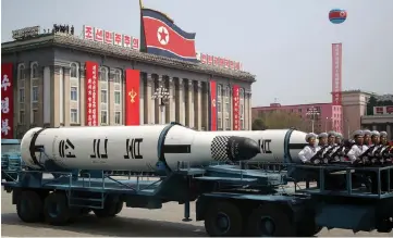  ??  ?? This undated picture released by North Korea’s official Korean Central News Agency on April 26 shows the demonstrat­ion of the armaments with the Korean People’s Army. North Korea staged its largest-ever military drill to mark the founding of the...