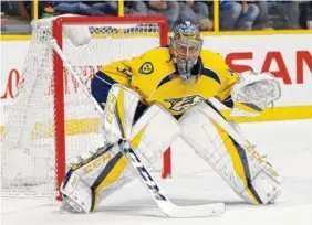  ?? ASSOCIATED PRESS FILE PHOTO ?? Nashville Predators goalie Pekka Rinne plays against the Colorado Avalanche during the first period of a game in Nashville in December. No goaltender has played better this postseason than Rinne for the Predators, though Jake Allen of the St. Louis...