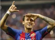  ?? ASSOCIATED PRESS FILE PHOTO ?? In this May 27 file photo, Barcelona’s Neymar celebrates at the end of the Copa del Rey final soccer match between Barcelona and Alaves.