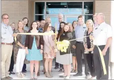  ?? LYNN KUTTER ENTERPRISE-LEADER ?? Jessica Haffelder, branch manager for Arvest Bank Prairie Grove, cuts the ribbon Sept. 18 for the branch’s grand opening ceremony. Prairie Grove Area Chamber of Commerce sponsored the ribbon cutting. The new branch is located at 999 E. Heritage Parkway.