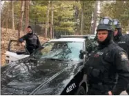  ??  ?? Saratoga Springs police prepare to make their way to the loading dock at the Saratoga Performing Arts Center amphitheat­er, where a gunman has been reported. The incident was part of a week-long training exercise.