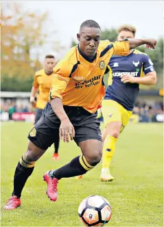  ??  ?? Bright spark: Merstham’s Alex Addai lines up a shot during an eye-catching display