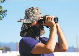  ?? ?? On Saturday, Matt Sadowski was among the approximat­ely 140 volunteers who helped collect data for the annual Christmas Bird Count.