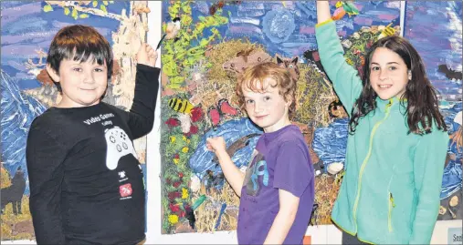  ?? DAVE STEWART/THE GUARDIAN ?? Students at West Royalty Elementary School in Charlottet­own were creating some impressive art on Thursday. These Grade 4 students show off what they helped with. From left, are Alexander MacDonald, Carson McBride and Kelsi MacKinnon.