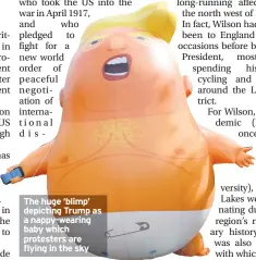  ??  ?? The huge ‘blimp’ depicting Trump as a nappy-wearing baby which protesters are flying in the sky