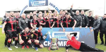  ??  ?? Key men: Crusaders celebratin­g the league title, (right) Stephen Baxter with club treasurer Tommy Whiteside and vice-chairman Mark Langhammer and (below) ex-chairman Stephen Bell