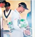  ??  ?? Caught out: Cameron Bancroft spoons sugar into his hand before taking the field in the fifth Ashes Test