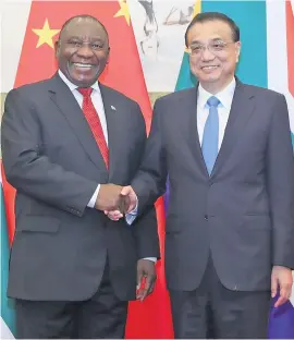  ?? Picture: Reuters ?? DONE DEAL. President Cyril Ramaphosa, left, and Premier Li Keqiang at Diaoyutai state guesthouse in Beijing, China, on Sunday.