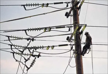  ?? Arkasha Stevenson Los Angeles Times ?? MOST OF the yearly $4 billion will go to upgrade electric poles, transforme­rs, wires and cables. About 6% will go to new power generation.