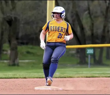  ?? Photo by Kim Sweigart ?? Lilly Steinburg of St. Marys reaches second base during Monday’s game against Marion Local. The Lady Riders won the contest by two runs.