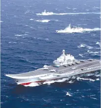  ?? (Reuters) ?? CHINA’S ‘LIAONING’ aircraft carrier conducts a drill in the South China Sea in December.
