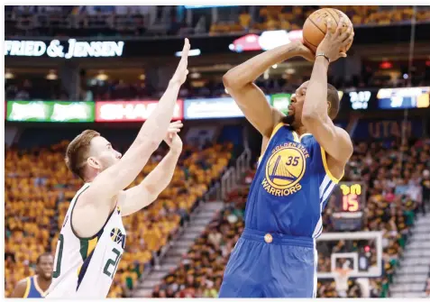  ??  ?? Golden State Warriors forward Kevin Durant shoots the ball over Utah Jazz forward Gordon Hayward during the second quarter in Game 3 of the second round of the 2017 NBA Playoffs at Vivint Smart Home Arena on Saturday. (USA TODAY Sports)