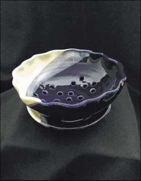  ??  ?? A ceramic bowl by Anne Gravett on display in her exhibit “Fire & Fiber” at Boulder City Art Guild Gallery.