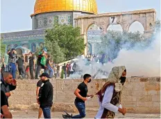  ??  ?? Running battle: Tear gas outside the Al-Aqsa mosque