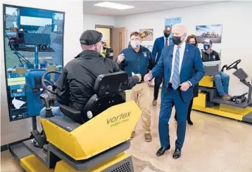  ?? EVAN VUCCI/AP ?? President Biden tours a union training facility with state lawmakers on Tuesday in Howell, Michigan.