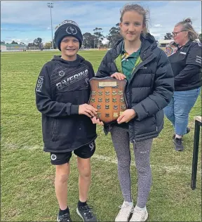  ?? ?? Berrigan Public School captains Jack Magill and Tahlia Wood with the shield.