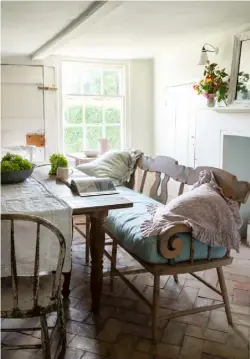  ??  ?? DINING ROOM Left The dining room bench was from Shabby Chic, now based in Los Angeles. Vintage fabrics are matched by an antique mirror from Rosehip on the mantelpiec­e