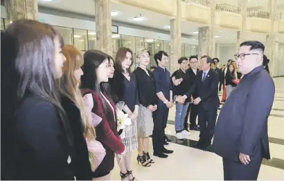  ?? Picture: AFP ?? NORTH MEETS SOUTH. North Korean leader Kim Jong-un, right, speaks to South Korean musicians after a rare concert by them at the 1 500-seat East Pyongyang Grand Theatre in Pyongyang.