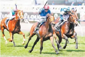  ?? Photo / Getty Images ?? Cross Counter surges to victory in last year’s Melbourne Cup.