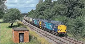  ??  ?? ABOVE: 37069 and 37716 pass Castle Gresley on the freight-only Coalville route with Pathfinder­s ‘Blue Boys Merrymixer’ on 1Z39 09:55 Bescot Up and Down Goods to
Crewe portion of the tour on August 7. The charter originated from Eastleigh at 05:31 with 68002 and ran from Bescot, via the Coalville line and Nuneaton. The long-disused trackbed to Netherseal Colliery once curved off to the left of the lineside hut. Phil Chilton