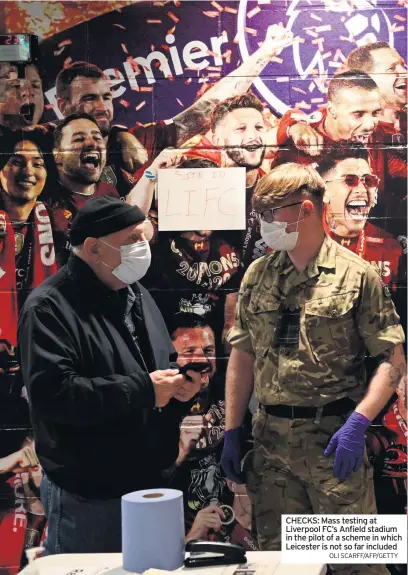  ?? OLI SCARFF/AFP/GETTY ?? CHECKS: Mass testing at Liverpool FC’s Anfield stadium in the pilot of a scheme in which Leicester is not so far included