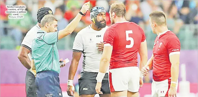  ?? Picture: STUFF ?? Tevita Cavubati, centre, of Fiji receives a yellow card.