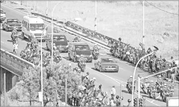  ??  ?? The motorcade transporti­ng the coffin of Winnie drives through Soweto after leaving her home towards Orlando Stadium for a funeral ceremony.