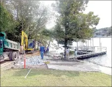  ?? Lynn Atkins/Weekly Vista ?? As the Lakes Committee met on Wednesday, work was getting underway on an extension to the Loch Lomond fishing dock, a project the group recommende­d to the Board of Directors in March. The Bella Vista Fly Tyers Club helped pay for the work which will move the existing dock into deeper water.