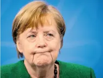  ?? AFP ?? Angela Merkel dio una inusual conferenci­a por la madrugada para anunciar el nuevo cierre/