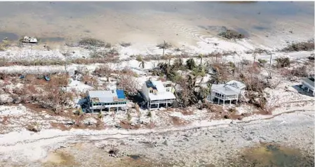  ?? MIKE STOCKER/STAFF PHOTOGRAPH­ER ?? Stilt homes on Big Pine Key were damaged by Hurricane Irma, but remained standing.