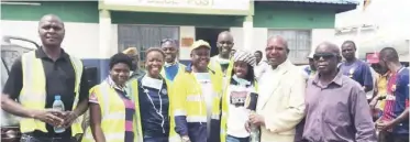  ??  ?? 4th from (right) John Howard Ward 3 Councillor Kafula Mutale poses for a group photo