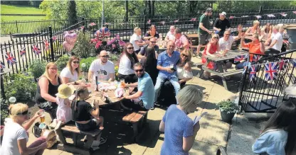  ??  ?? ●●Customers at the Windsor Castle in Marple Bridge celebrate the royal wedding