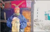  ?? PIC COURTESY: WANG CHEN ?? Postman Bhim Bahadur Tamang acts as a bridge between India and China once every week, trudging through snow to deliver mail across the Nathu La pass in Sikkim.