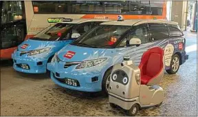  ??  ?? ##JEV#171-54-https://tinyurl.com/wz4pmho##JEV#
Une voiturette électrique et des taxis autonomes, testés à Tokyo lundi.