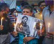  ?? (AFP) ?? Media personnel pay homage to Reuters journalist Danish Siddiqui in New Delhi on Saturday.