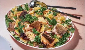  ?? (Photo for The Washington Post by Rey Lopez) ?? A crispy rice and fish salad with herbs is a modern way to mark Nowruz.