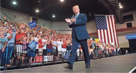  ?? SAUL LOEB, AFP/GETTY IMAGES ?? President Trump hits the stage for another one of his campaign-style rallies Thursday evening in Huntington, W.Va.