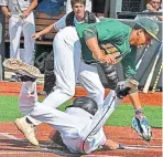  ?? CHRIS CHRISTO / HERALD STAFF ?? GIVING IT ALL: Latin Academy’s Quinn Kelly slides safely into home past the tag by Snowden’s John Hernandez during Sunday’s City League championsh­ip.