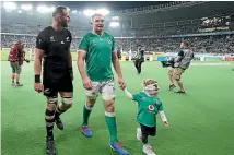  ??  ?? Rivals on the field, mates off it: Kieran Read walks off Toyko Stadium with Peter O’Mahony after the quarterfin­al.