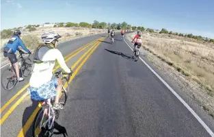  ?? LUIS SÁNCHEZ SATURNO/THE NEW MEXICAN ?? Krista Rogers of Santa Fe rides during the Santa Fe Century. About 2,500 riders participat­ed in the 25-, 50- or 100-mile courses or the new 20-mile dirt trail.