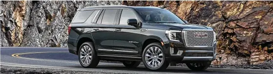  ?? CONTRIBUTE­D ?? The 2022 GMC Yukon Denali doesn’t try to look small; it embraces its size with a bold, chain-mesh-like grille and chrome accents.