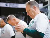  ?? AL GOLDIS/AP ?? Tom Izzo observes a moment of silence Tuesday before Michigan State’s first home game since a campus shooting killed three students and injured five others.