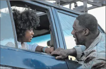  ?? Lauren Mulligan
Universal Pictures ?? Idris Elba with Leah Jeffries in a scene from “Beast,” now in theaters.