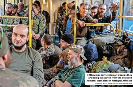  ?? ALESSANDRO GUERRA/EPA-EFE/REX/Shuttersto­ck ?? > Ukrainian servicemen on a bus as they are being evacuated from the besieged Azovstal steel plant in Mariupol, Ukraine