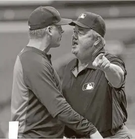  ?? Brian Blanco / Getty Images ?? Astros manager A.J. Hinch didn’t last long Thursday as he was ejected by umpire Joe West in the first inning.