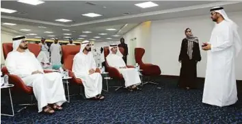  ?? WAM ?? Shaikh Mohammad with Mohammad Abdullah Al Gergawi, Hussain Ebrahim Al Hammadi, Jameela Salem Al Muhairi and Ahmad Abdullah Humaid Bel Houl Al Falasi.