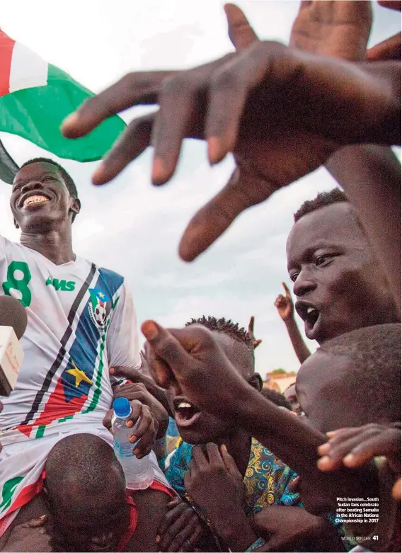  ??  ?? Pitch invasion…South Sudan fans celebrate after beating Somalia in the African Nations Championsh­ip in 2017