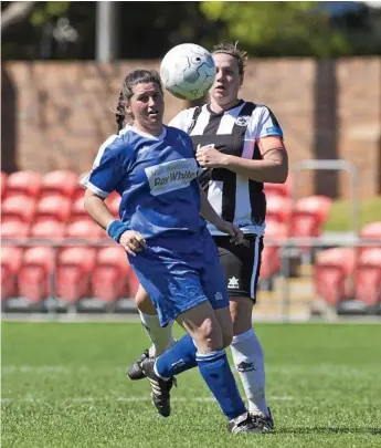  ?? Photo: Kevin Farmer ?? CLOSE CONTEST: Rockville’s Penny Dukes (left) for Rockville and Willowburn’s Kiama Gray battle for possession during last year’s Toowoomba Football League Premier Women’s grand final.