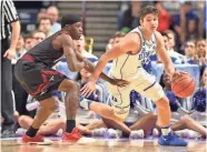  ?? / USA TODAY SPORTS ?? Duke guard Grayson Allen, who finished with 21 points, handles the ball Friday night against Troy guard Kevin Baker.