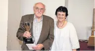  ??  ?? Brynmor Jones, Caernarfon, receiving the Dafydd Ellis Cup from judge Gwennant Pyrs